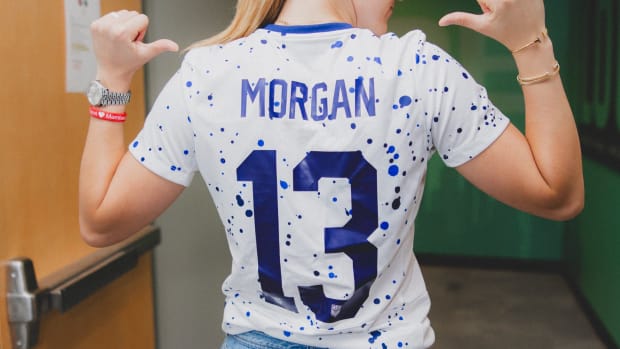 Sabrina Ionescu wears Alex Morgan's soccer jersey.